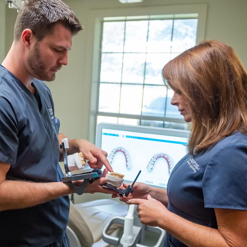 two doctors with model